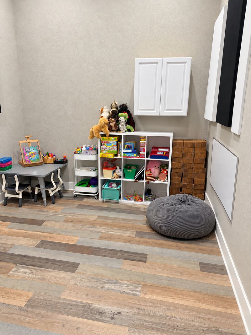 Frisco playroom with a child-size table and chairs, toy shelves, puppets and a bean bag